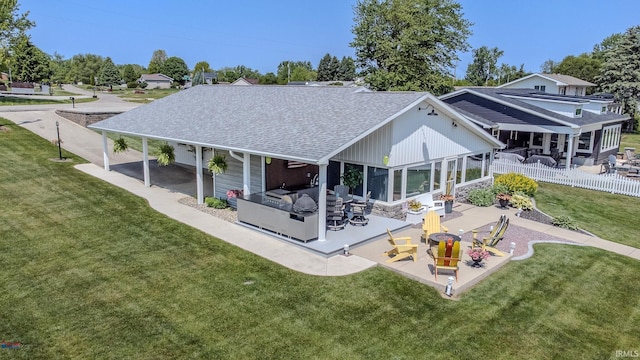 11382 N Biscayne Ln, Cromwell, IN 46732 - rear view of property featuring a shingled roof and a patio area