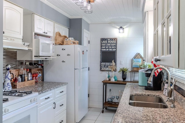 11382 N Biscayne Ln, Cromwell, IN 46732 - kitchen with white appliances, a sink, under cabinet range hood, white cabinetry, and light stone countertops