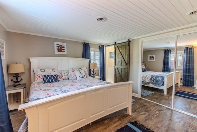 11382 N Biscayne Ln, Cromwell, IN 46732 - bedroom with a barn door, ornamental molding, dark wood-type flooring, a closet, and wooden ceiling