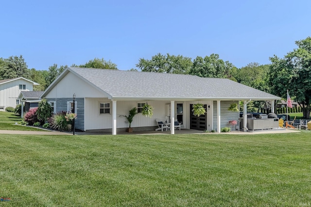 11382 N Biscayne Ln, Cromwell, IN 46732 - view of front facade with a front yard, a jacuzzi, and roof with shingles