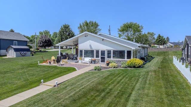 11382 N Biscayne Ln, Cromwell, IN 46732 - back of house with a patio area, a yard, and stone siding
