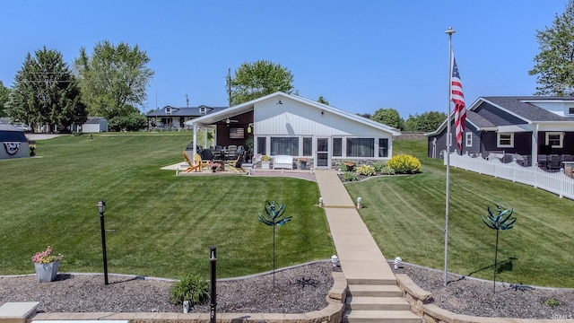11382 N Biscayne Ln, Cromwell, IN 46732 - rear view of house featuring a patio area, a lawn, and stone siding