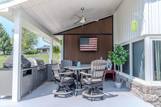 11382 N Biscayne Ln, Cromwell, IN 46732 - wooden deck with area for grilling, outdoor dining area, and ceiling fan