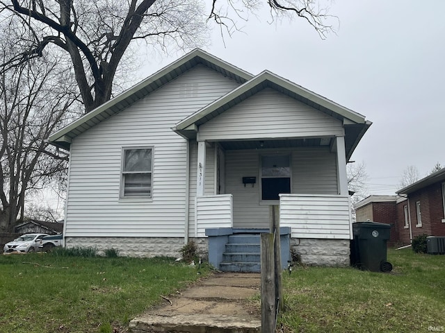 1311 S 31st St, South Bend, IN 46615 - bungalow-style house with a porch, a front yard, and central AC