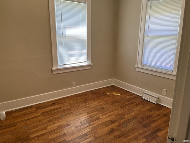 1311 S 31st St, South Bend, IN 46615 - spare room with baseboards and dark wood-type flooring