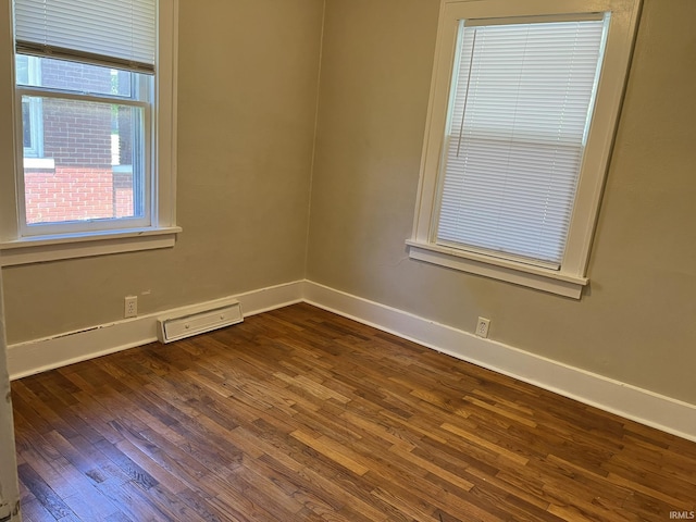 1311 S 31st St, South Bend, IN 46615 - unfurnished room with baseboards and dark wood-style flooring