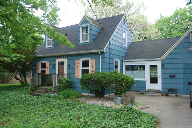 2310 Homewood Ave, Mishawaka, IN 46544 - cape cod-style house with a patio
