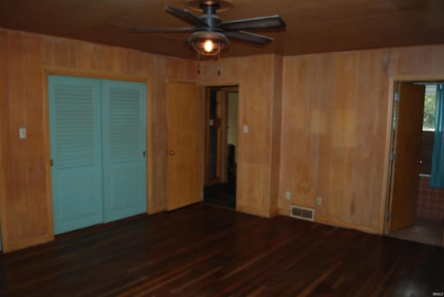 2310 Homewood Ave, Mishawaka, IN 46544 - unfurnished room with wood finished floors, a ceiling fan, and wooden walls