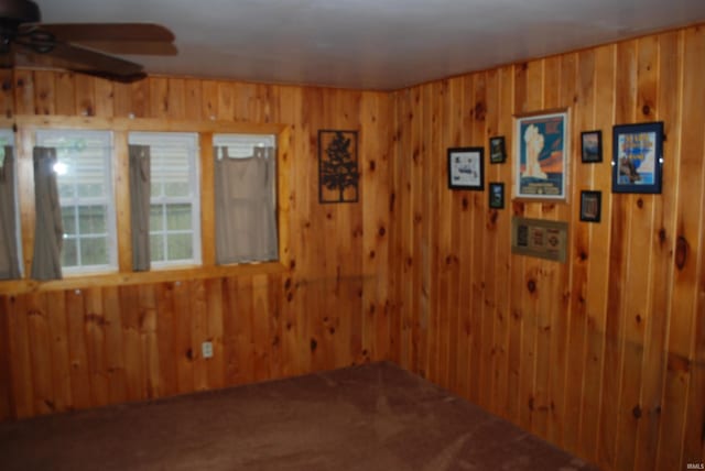 2310 Homewood Ave, Mishawaka, IN 46544 - carpeted empty room with a ceiling fan and wooden walls
