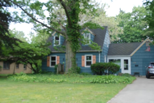 2310 Homewood Ave, Mishawaka, IN 46544 - new england style home with driveway and a front lawn