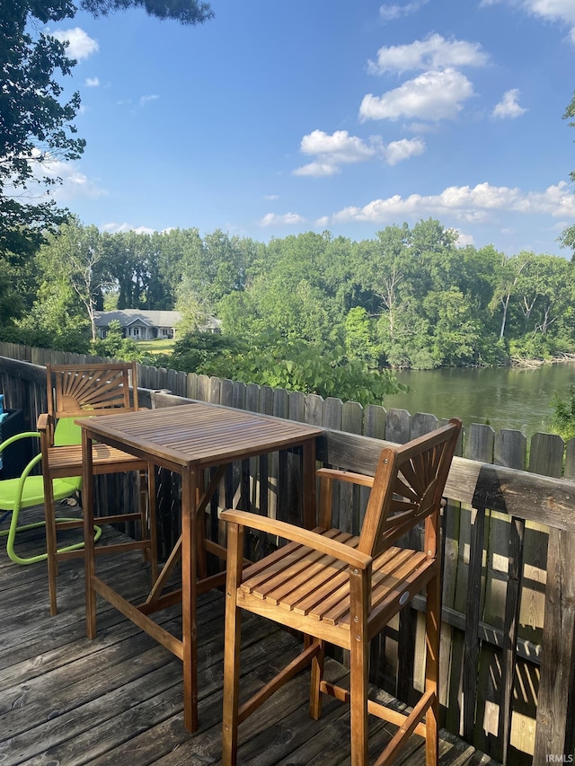 2310 Homewood Ave, Mishawaka, IN 46544 - wooden deck featuring a water view and outdoor dining area