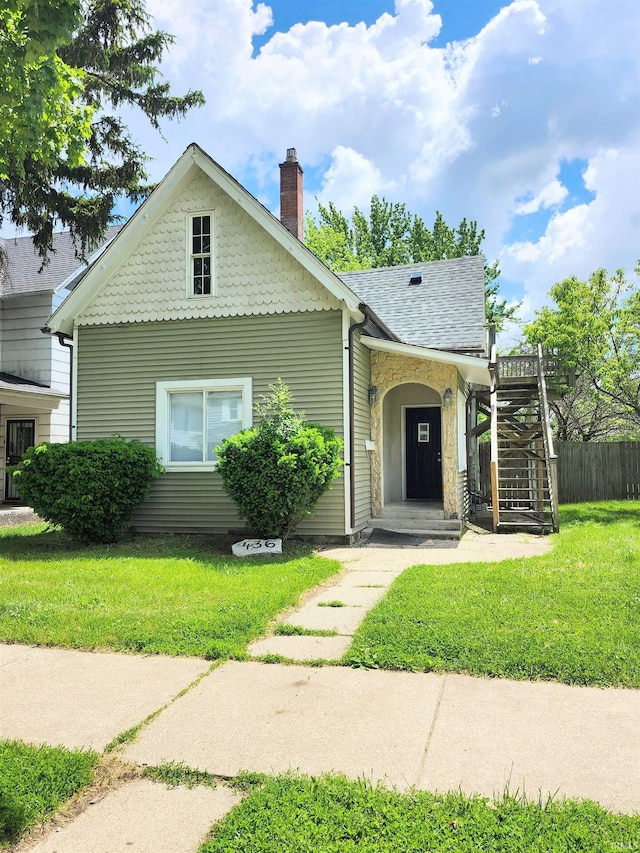 436 E Taber St, Fort Wayne, IN 46803 - view of front facade with a chimney and a shingled roof