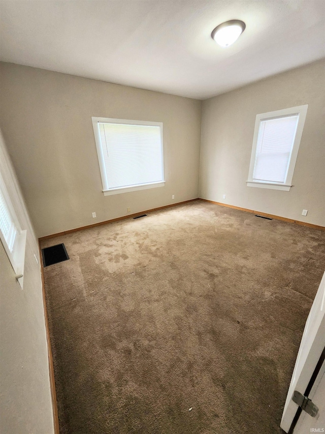 436 E Taber St, Fort Wayne, IN 46803 - carpeted empty room with healthy amount of natural light and baseboards
