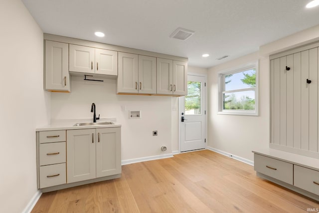11136 N 200 W, Ossian, IN 46777 - laundry area featuring a sink, hookup for an electric dryer, washer hookup, light wood-style floors, and recessed lighting