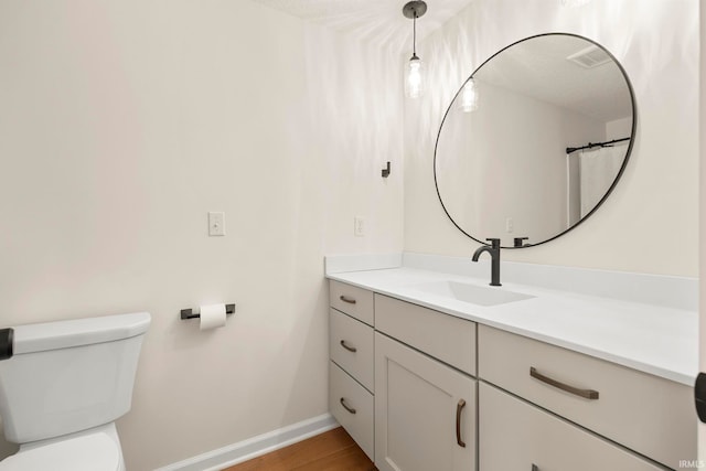 11136 N 200 W, Ossian, IN 46777 - full bath with vanity, toilet, baseboards, and wood finished floors