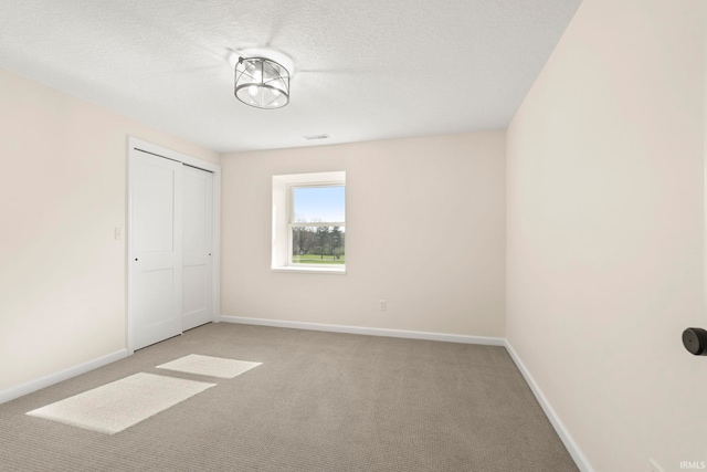 11136 N 200 W, Ossian, IN 46777 - unfurnished bedroom featuring light carpet, baseboards, a closet, and a textured ceiling