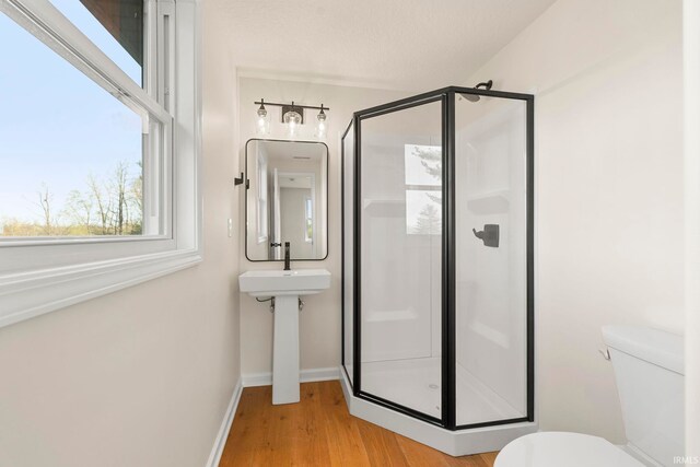 11136 N 200 W, Ossian, IN 46777 - full bath featuring a shower stall, toilet, wood finished floors, and baseboards