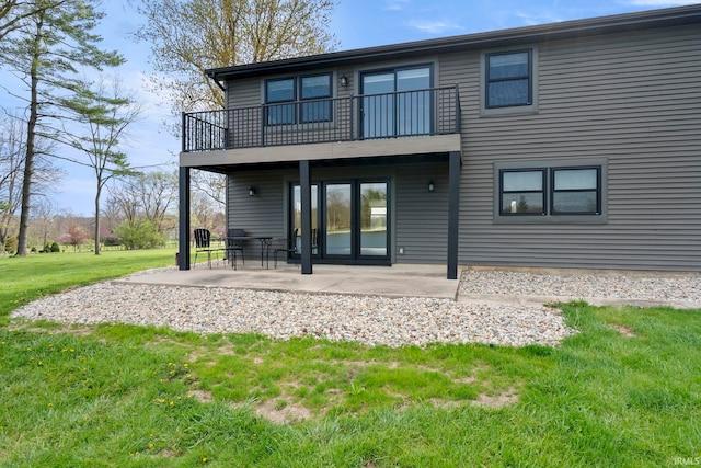 11136 N 200 W, Ossian, IN 46777 - rear view of house with a balcony, a lawn, and a patio