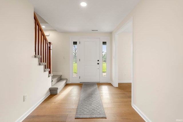 11136 N 200 W, Ossian, IN 46777 - foyer entrance with stairway, light wood finished floors, recessed lighting, and baseboards