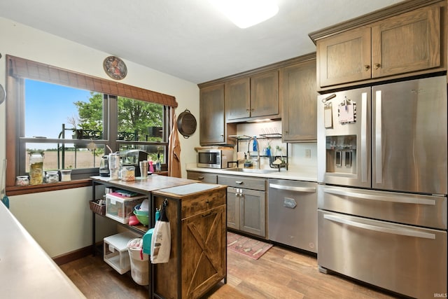 2090 S Warren Rd, Huntington, IN 46750 - kitchen featuring stainless steel appliances, light wood-style flooring, and light countertops
