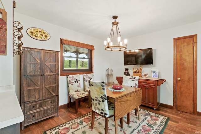 2090 S Warren Rd, Huntington, IN 46750 - dining area featuring a chandelier and dark wood-style floors