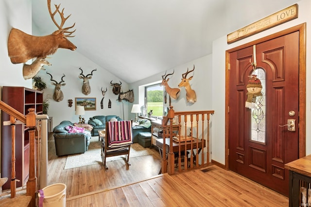 2090 S Warren Rd, Huntington, IN 46750 - entryway with light wood finished floors and vaulted ceiling