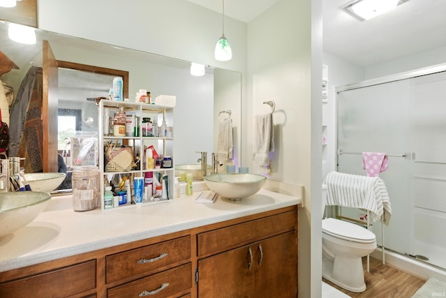 2090 S Warren Rd, Huntington, IN 46750 - full bath featuring double vanity, a shower stall, and wood finished floors
