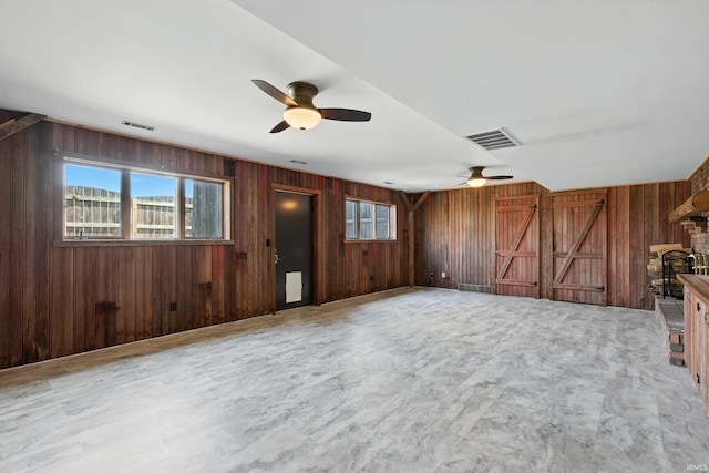 2090 S Warren Rd, Huntington, IN 46750 - unfurnished living room with a ceiling fan and wood walls