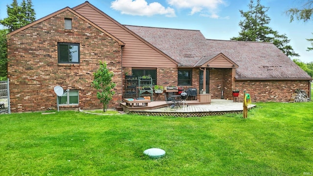 2090 S Warren Rd, Huntington, IN 46750 - rear view of house with a deck, brick siding, and a yard