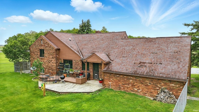 2090 S Warren Rd, Huntington, IN 46750 - back of house featuring brick siding, a wooden deck, and a lawn