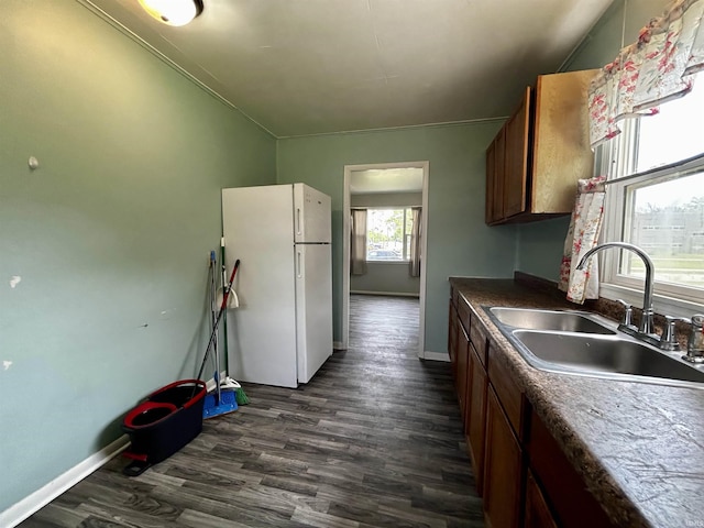 4314 Smith St, Fort Wayne, IN 46806 - kitchen featuring freestanding refrigerator, a sink, dark wood-style flooring, and baseboards