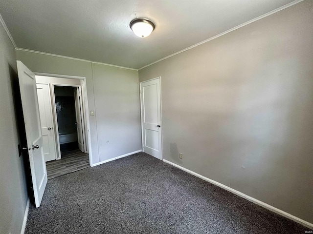 4314 Smith St, Fort Wayne, IN 46806 - unfurnished bedroom featuring dark carpet, crown molding, and baseboards
