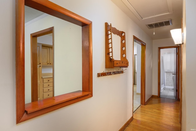 922 N Broadway St, Seymour, IN 47274 - hallway featuring attic access, light wood-style flooring, and baseboards