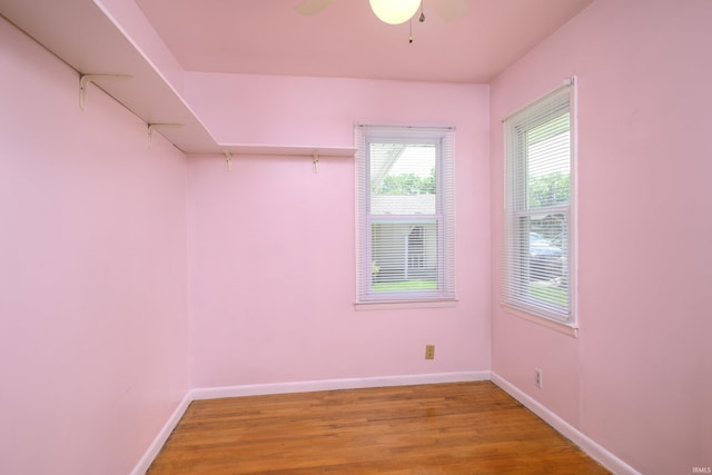 922 N Broadway St, Seymour, IN 47274 - empty room with baseboards, light wood-style flooring, and ceiling fan