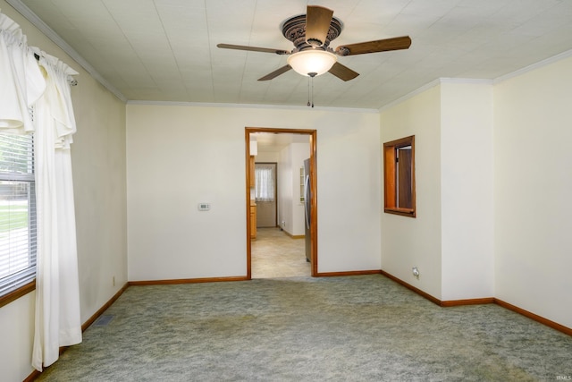 922 N Broadway St, Seymour, IN 47274 - unfurnished room featuring plenty of natural light, carpet flooring, crown molding, a ceiling fan, and baseboards