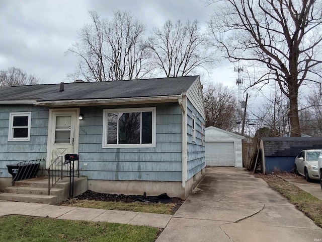 1006 W Rose St, South Bend, IN 46616 - view of front of property featuring a detached garage, an outbuilding, and driveway