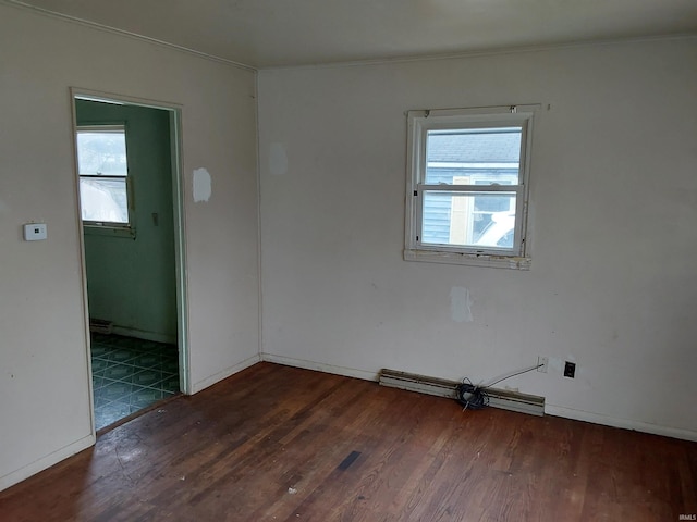 1006 W Rose St, South Bend, IN 46616 - spare room featuring wood finished floors, crown molding, and baseboards