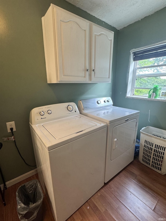 14512 Old State Road 37, Tell City, IN 47586 - laundry room with cabinet space, independent washer and dryer, wood finished floors, and a textured ceiling