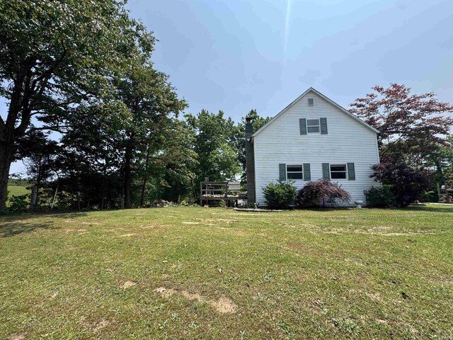 14512 Old State Road 37, Tell City, IN 47586 - view of property exterior with a yard and a chimney