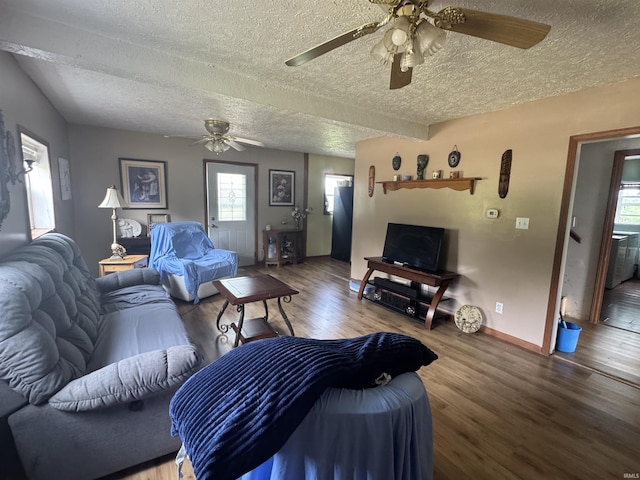 14512 Old State Road 37, Tell City, IN 47586 - living area featuring a textured ceiling, ceiling fan, wood finished floors, healthy amount of natural light, and baseboards
