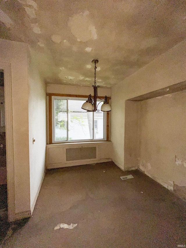 402 W Elm St, Gaston, IN 47342 - unfurnished dining area featuring a chandelier, carpet, and radiator heating unit