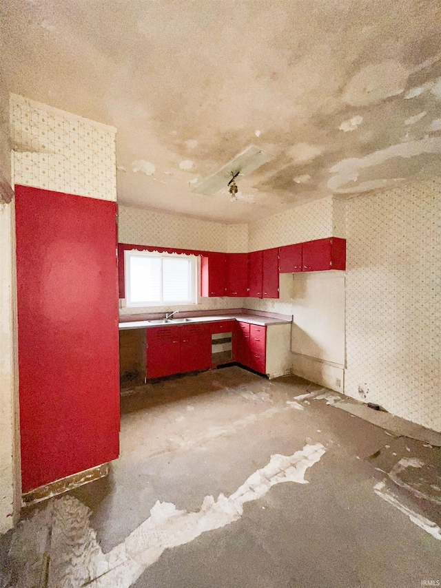 402 W Elm St, Gaston, IN 47342 - kitchen featuring red cabinetry and a sink