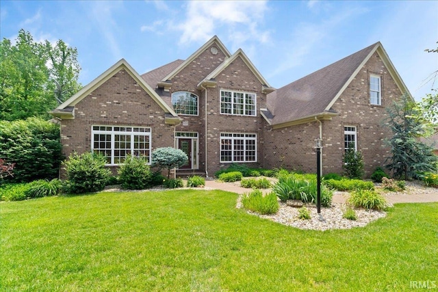 6444 Pebble Pointe Ct, Newburgh, IN 47630 - view of front of property featuring brick siding, a front lawn, and roof with shingles