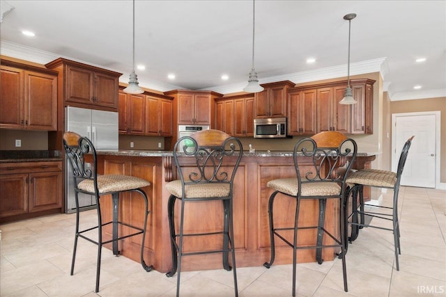 6444 Pebble Pointe Ct, Newburgh, IN 47630 - kitchen with appliances with stainless steel finishes, crown molding, recessed lighting, a kitchen bar, and brown cabinetry