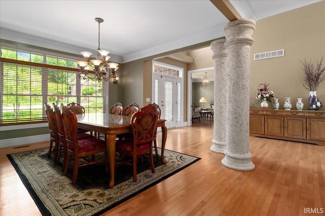 6444 Pebble Pointe Ct, Newburgh, IN 47630 - dining space featuring a chandelier, ornate columns, light wood finished floors, and crown molding