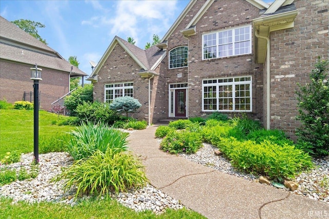 6444 Pebble Pointe Ct, Newburgh, IN 47630 - traditional home with brick siding and a front yard