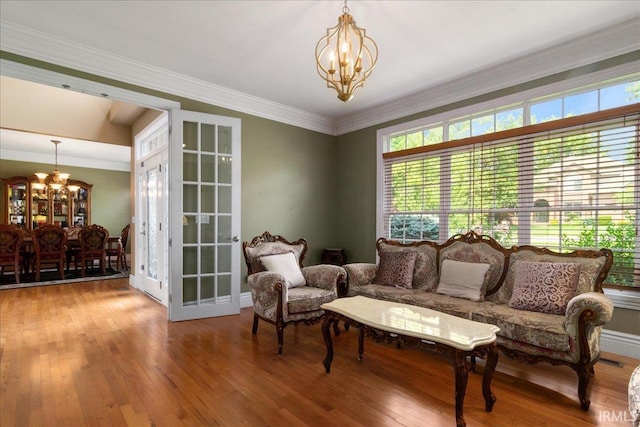 6444 Pebble Pointe Ct, Newburgh, IN 47630 - sitting room with a chandelier and wood-type flooring