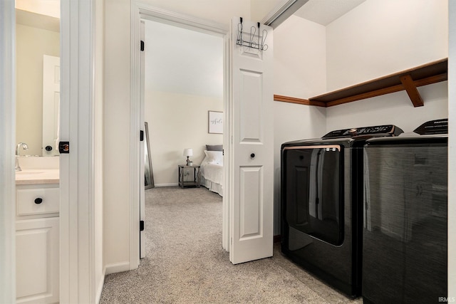 58201 Windsong Dr, Elkhart, IN 46517 - laundry area featuring light carpet, independent washer and dryer, and baseboards