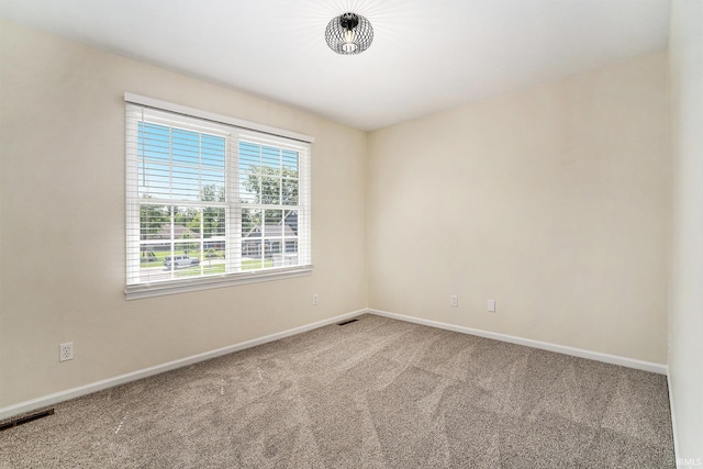 58201 Windsong Dr, Elkhart, IN 46517 - spare room featuring carpet floors and baseboards