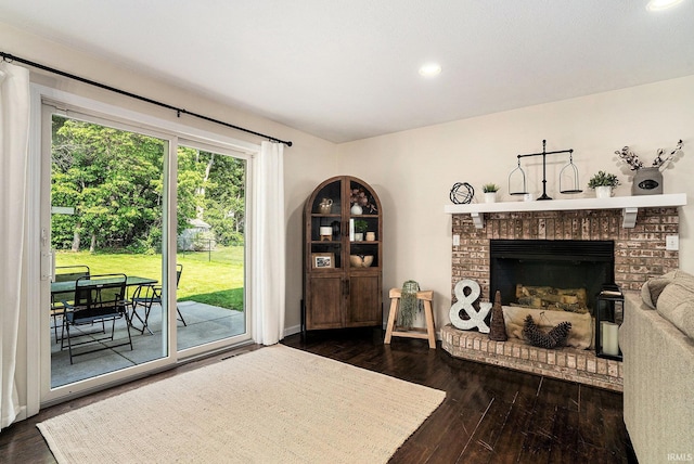 58201 Windsong Dr, Elkhart, IN 46517 - living room featuring dark wood-type flooring, recessed lighting, and a fireplace